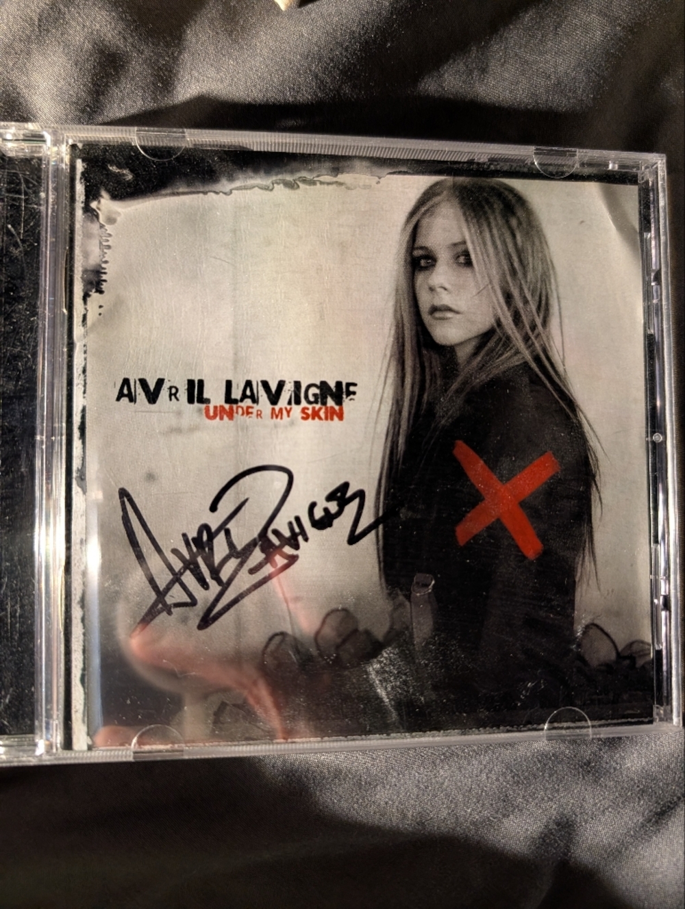Signed Avril Lavigne "Under My Skin" CD - Black & White with Red Accent